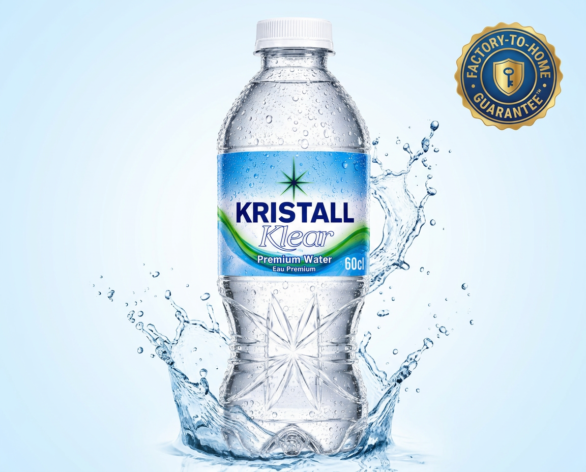 Close-up of a real Kristall Klear 60cl bottle and sealed 12-pack carton showcasing authentic product packaging.